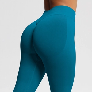 Detail showing peacock blue seamless knit fabric with high waist and push-up effect