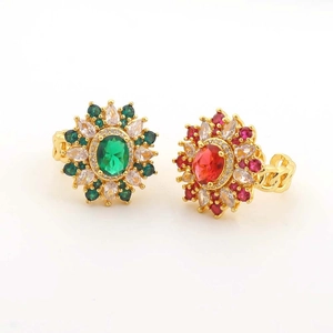 Gold chain ring set with emerald and ruby stones in floral halo design