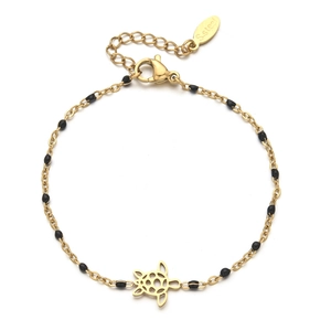 Detail of gold stainless steel bracelet with black beads and hollow turtle pendant