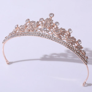 Macro detail of rose gold bridal crown featuring crystal rhinestones and floral patterns