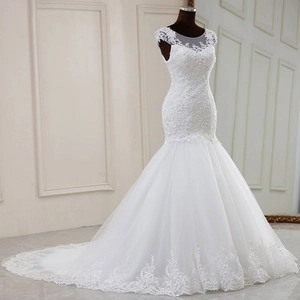 Elegant white mermaid bridal gown with sheer lace bodice and long train in classic French style