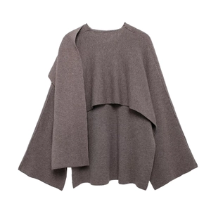 Detail view of brown knit cardigan with unique scarf collar and wide sleeves