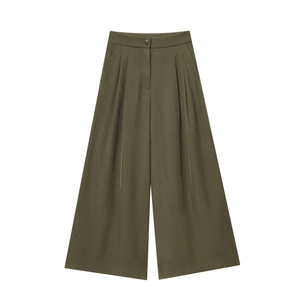 Detail of high-waisted army green wide-leg trousers with front pleats and draped fabric