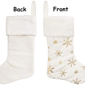 White plush Christmas stocking with gold snowflake embroidery showing front and back views