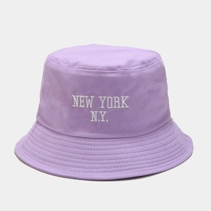 Detail of light purple cotton bucket hat featuring white NEW YORK embroidery and neat stitching
