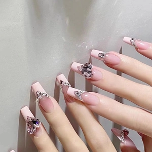Pink gradient press-on nails with heart-shaped rhinestones in long square shape