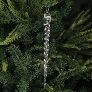 Clear acrylic icicle ornament with spiral texture hanging on a green Christmas tree