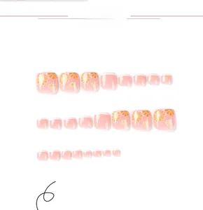 Detail of pink gradient press-on toenails with yellow daisy floral and white french tips