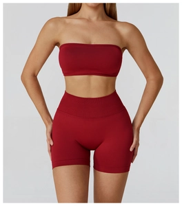 Detail of red seamless yoga set featuring a rib-knit sports bra and high-waist shorts