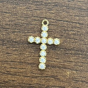 Close-up of 18K gold plated brass cross pendant with 3A cubic zirconia stones inlay
