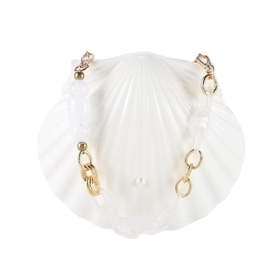 Elegant shell-shaped evening bag with white acrylic and gold metal chain links