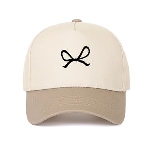 Two-tone cotton five-panel baseball cap with bow embroidery and curved brim in tan and white