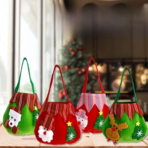 Detail of four festive felt Christmas gift bags with 3D Santa and reindeer appliques