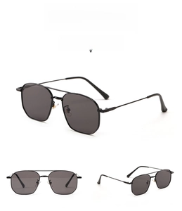Detail view of model 63058 aviator sunglasses with black metal frame and dark grey lenses