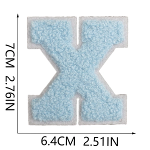 Macro detail of 7cm blue chenille letter X patch showing soft texture and dimensions