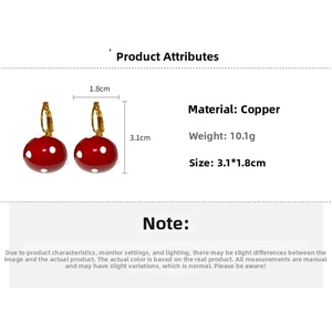 Detail showing dimensions and 10.1g weight of the gold mushroom pearl hoop earrings