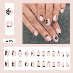 Short oval aurora nude pink press-on nails with minimalist black floral silhouettes
