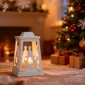 White Christmas tree cutout candle holder lantern with warm candle light and festive decor