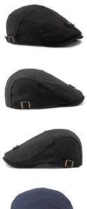 Detail view of black vintage ivy cap with bronze side buckle and washed cotton texture