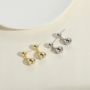 Minimalist gold and silver drop earrings with spherical studs and water drop pendants