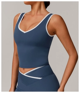 Detail of V-neck yoga tank top and high-waisted leggings with white contrast trim
