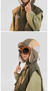 Detail of kids olive green pilot hat with fleece lining and vintage aviation goggles