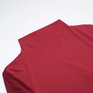 Detail shot of the red high-neck sheer mesh top featuring clean seams and fine texture