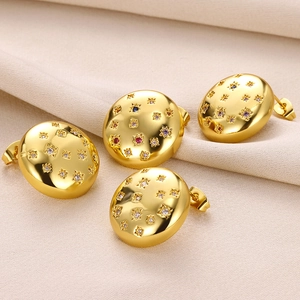 French style gold stud earrings with colorful zircon star engraving on polished metal