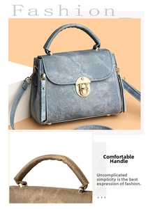 Detail of elegant handbags featuring denim-textured material and gold metallic twist locks