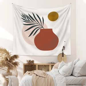 Detail of bohemian tapestry with red vase and gold circles in a modern bedroom setting