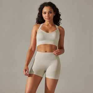 Close-up of seamless beige sports set with ribbing texture for yoga and fitness training