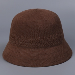 Close-up of brown knitted bucket hat featuring detailed hollow out weaving pattern
