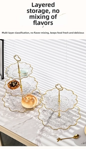 Detail of multi-tier glass fruit tray with hammer texture and golden metal handle