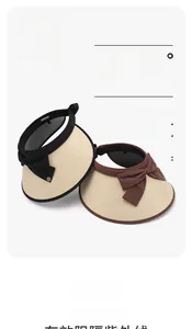 Close-up of lightweight straw sun visors with bow decor and UPF50+ protection