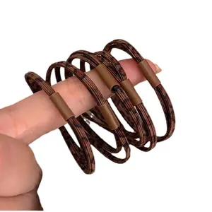 Five leopard print high elastic hair bands with durable brown fabric and plastic buckles