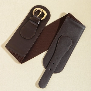 Detailed view of coffee brown wide corset belt with elastic band and gold metal buckle