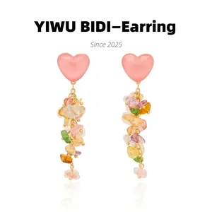 Bohemian silver needle earrings featuring pink heart charms and colorful stone tassels