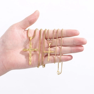 Detailed comparison of two gold stainless steel cross pendants in small and large sizes