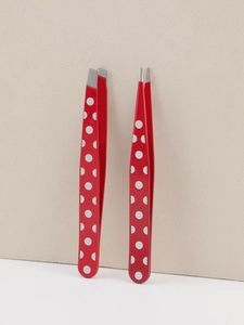 Detail view of red polka dot tweezers set including slanted and pointed tips