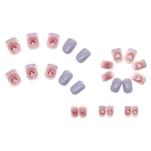 Short square press-on nails in purple gradient with heart designs and French tips