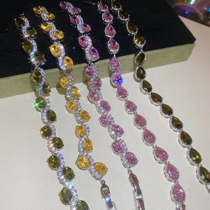 Detailed view of colorful teardrop zircon bracelets in various gemstone shades