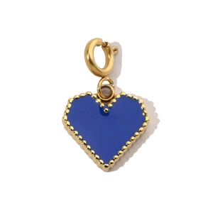 Close-up of heart charm with blue enamel inlay and gold-plated beaded edge detail