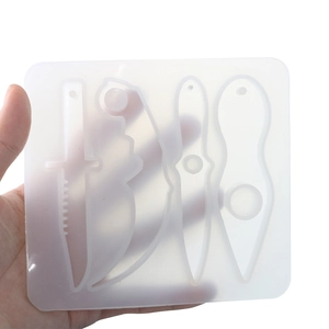 Macro view of 4-cavity silicone mold for resin dagger pendants with hanging holes
