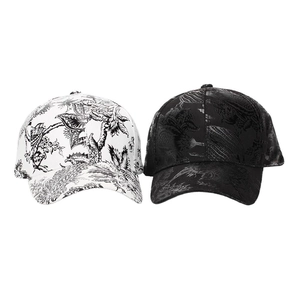 Detail of white and black baseball caps with ink painting tropical floral prints