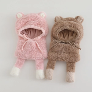 Detailed close-up of plush bear ear hat showing soft faux fur texture and warm lining