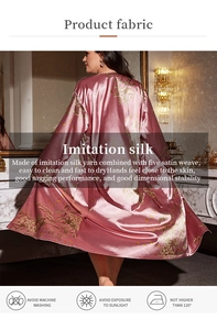 Detail of floral pink satin robe showing elegant drape and smooth imitation silk fabric texture