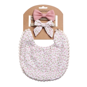 Baby Lätzchen und Stirnband Set in Rosa mit Blumenmuster und Pompon Verzierung