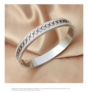 Detailed macro of silver-colored hollow chain steel bracelet with sparkling zircons