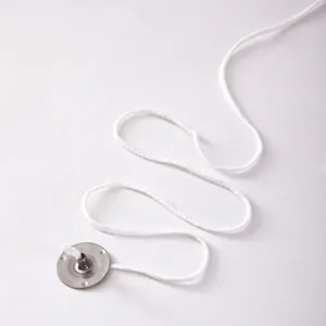 Close-up of 24-ply braided cotton candle wick with a round metal sustain tab base