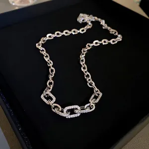 Chic silver paperclip chain necklace with sparkling cubic zirconia on black jewelry box